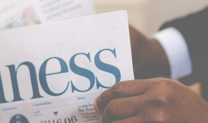 small business security - man reading business newspaper