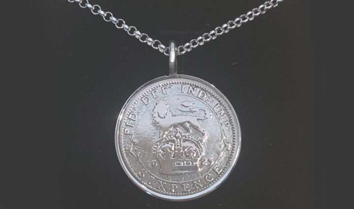 Close up of a 1925 Lucky Sixpence Pendant from Hersey & son