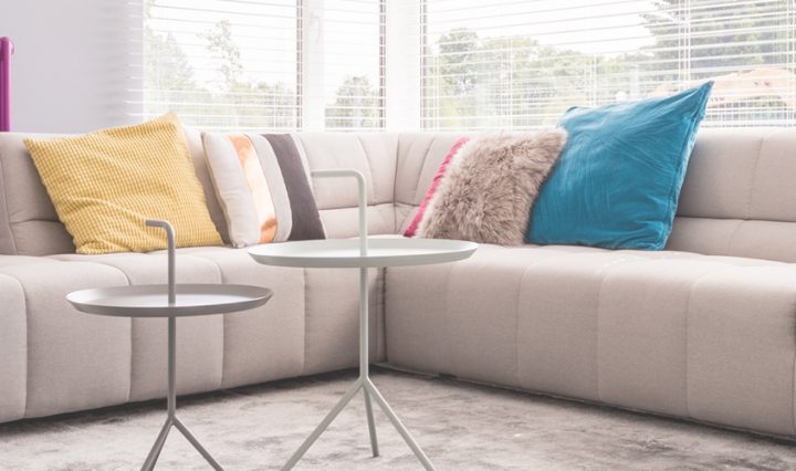 A lounge showing a purple radiator which has just had a power flush your central heating after reading boiler myths.