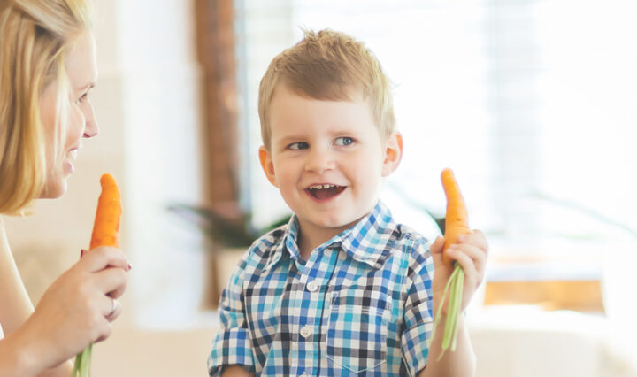child and mother eating raw carrots - meal ideas for picky eaters